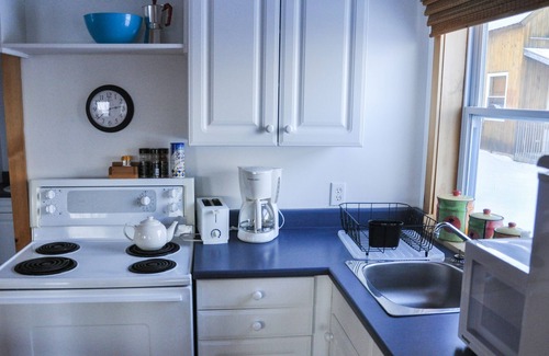 Indian Brook Ski Chalet | Tan Chalet at Cabot Shores Wilderness Resort