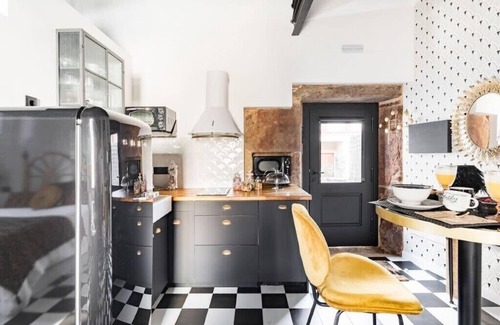 Corcubion Apartment | The 20's Suite. Loft with bathtub, outdoor terrace and wood-burning fireplace.