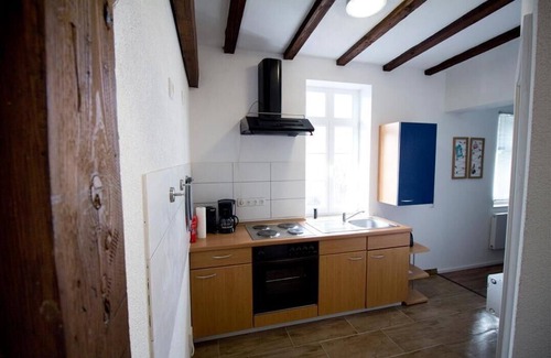 Alsfeld Apartment | The apartment offers a living/bedroom with a laminate floor, a complete kitchenette with fridge/freezer combination and a completely new, stylish bathroom on a total living space of approx. 40 sqm.