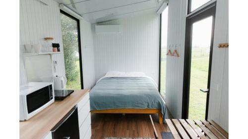 Waimangaroa House | The Coast 1 by Tiny Away