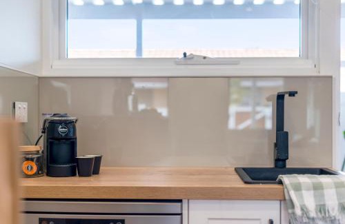 Christies Beach Apartment | The Elements l Earth l 4 Stunning Apartments each with Private Outdoor Dining l Walk to the Beach l Pet Family and Event Friendly l Wifi l Netflix l Outdoor Shower l Communal BBQ Pavilion and Lawn Area l