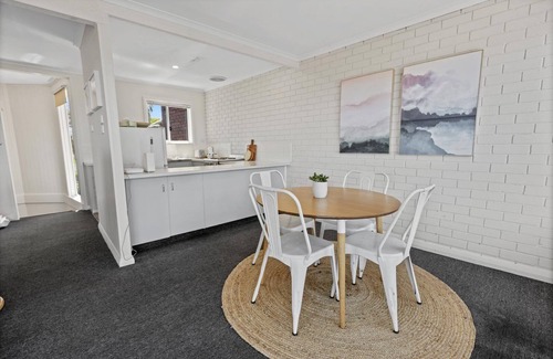 Paynesville House | The Lake Villa - Enjoy views over the treetops of downtown as you relax