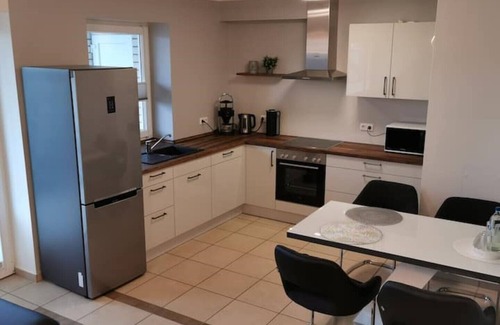 Bad Essen Apartment | The modern Welness apartment is located in Bad Essen with a view of the Wiehengebirge mountains.