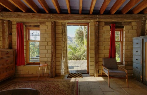 Pigeon Bay Apartment | The Mud House— earth studio in Pigeon Bay with views, wood-fired sauna & bath!