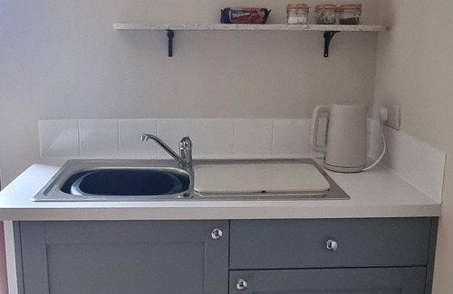 Church Knowle Apartment | The Old Post Office, annex with bedroom, onsuite and lounge with kitchenette.