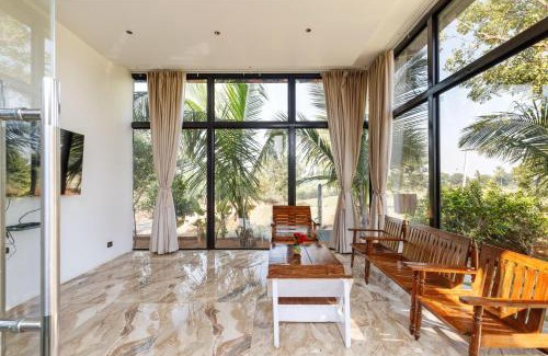 Bhongir Villa | TheSunlitHaven Pool GlassRooms Lawn