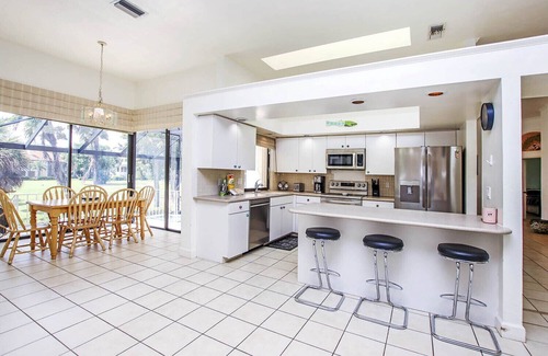 Beachview Country Club Estates House | Tin Cup - Beachview Estates home with pool on golf course