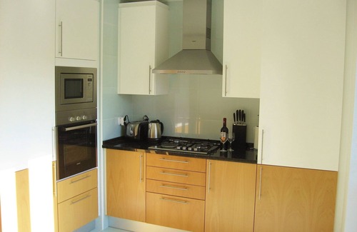 Olhao Apartment | Top-floor frontline apartment, sea views, rooftop pool, easy walk historic Olhao