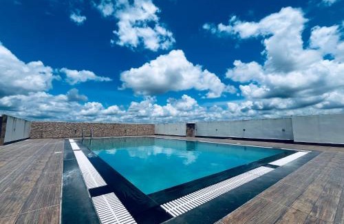 Nedumbassery Apartment | Transit suites by Habitat