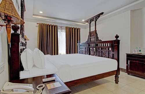 Cherthala Hotel | Treebo Premium Travancore Palace Cherthala