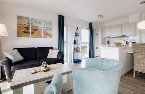 Schillig Apartment | Vacation apartment with a view of the sea and meadows, sauna & electric fireplace for relax