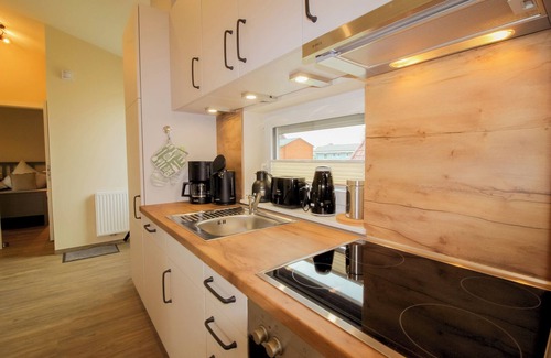 Dorumer Neufeld House | Vacation bungalow Mellumplate 20, modern and at ground level.