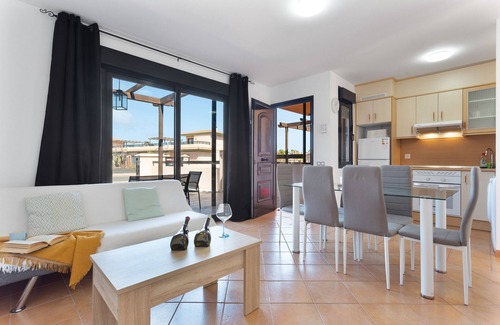 La Oliva Apartment | Vacation 'Punta Calma' with Sea View, Shared Pool and Wi-Fi