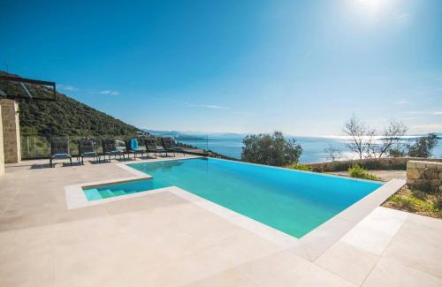 Petaleia Villa | Villa Nissaki View 2 by Villa Plus