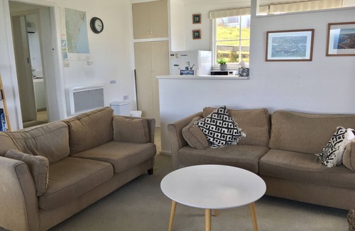 Kakanui House | Watch the weather roll in along the coast with sea views from every room.