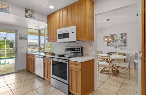 Caloosahatchee House | Waterfront Serenity beckons you to experience the ultimate canal-side retreat in stunning Cape Coral