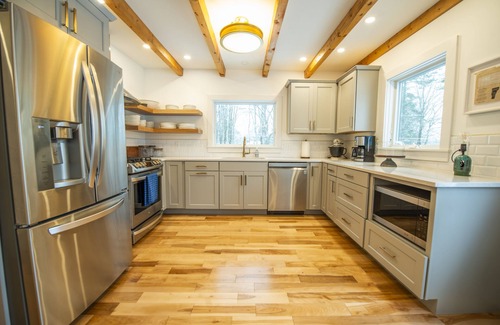 Jericho House | Woodlands: Luxury Vermont log cabin with sweeping views of field and forest.