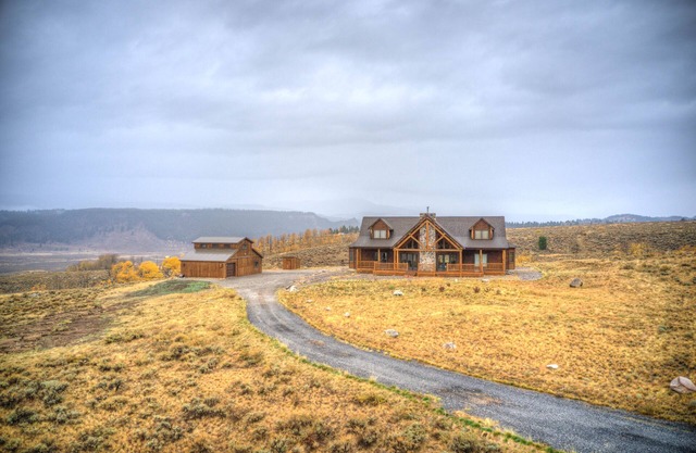 A True Montana Cabin with Sweeping Views of the Mountains and the Madison River.