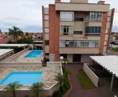 Aconchegante apartamento com piscina
