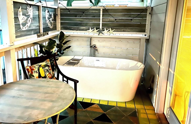 After beach time come back to an outdoor soaking tub in privacy fenced back yard