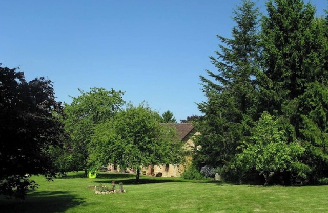 An authentic Percheron house: fireplace, beams, terracotta floor tiles, a large park