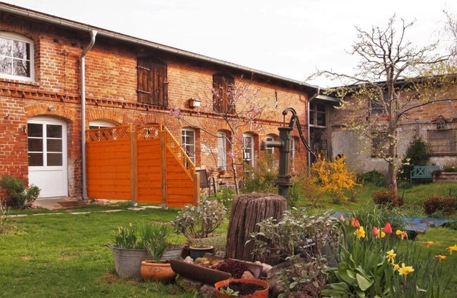 Apartment in a farmhouse with idyllic courtyard and natural garden