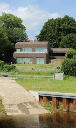 Architect House With Vintage Classics By River