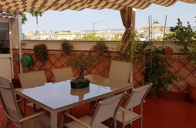 At the foot of the Roman Bridge