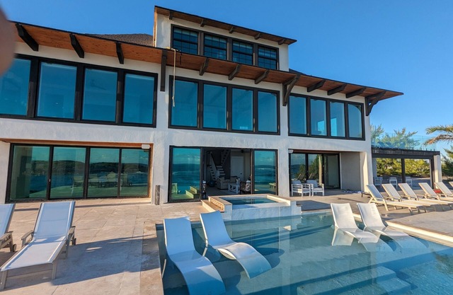 Beachfront estate home with private 70’ dock and 7500sq ft. of living space