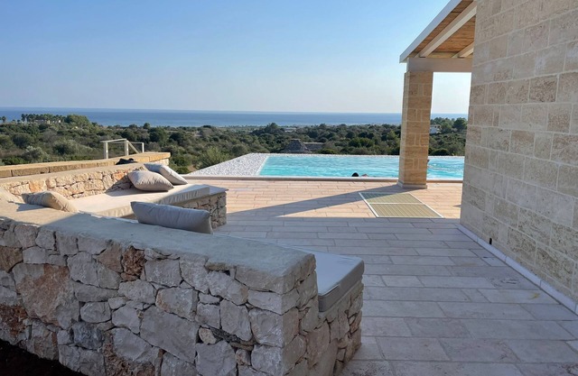 Blue door Trullo with sea view pool
