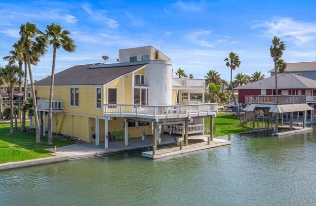 Canal Front Getaway with Boat Slip & Game Room