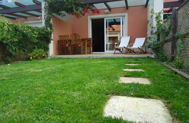 Charming and modern apartment with private garden near the beach of São Julião