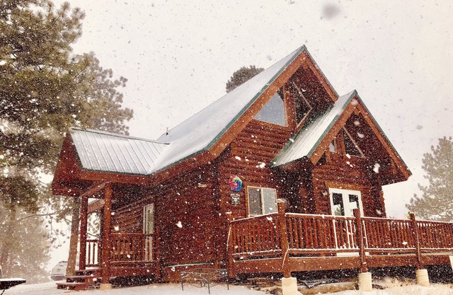 Charming log cabin in the mountains.