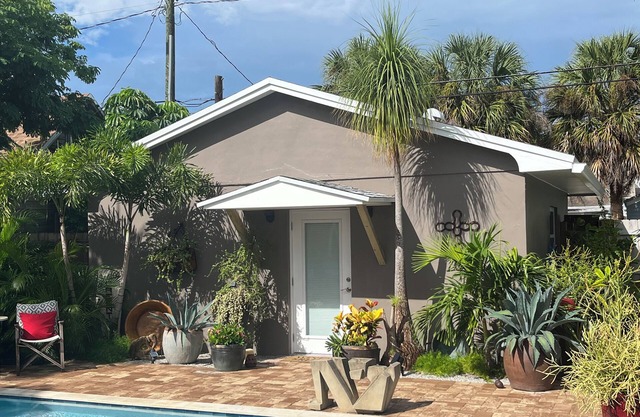 Chill on the patio overlooking the pool & lush gardens with privacy!