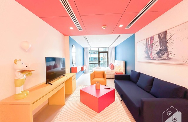 Colorful Studio with Balcony & City Views