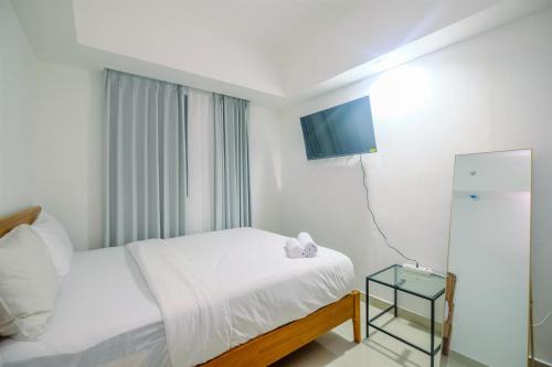 Comfort 1BR Apartment at Evenciio Margonda By Travelio