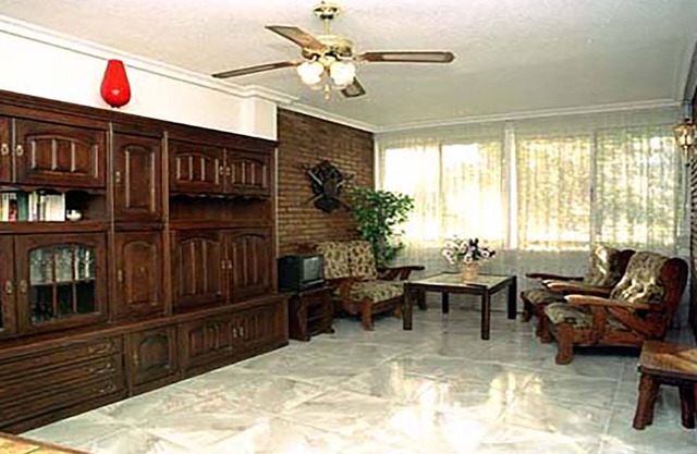 Comfortable conditioned apartment with three dormitories sorrounded by gardens.