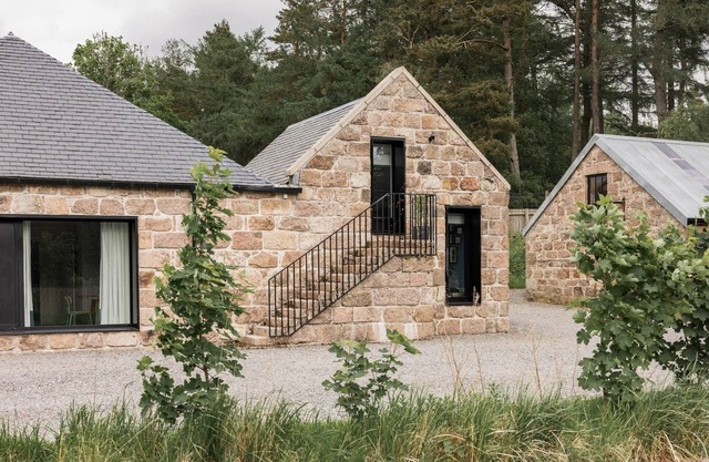 Countryside cottage featuring a spacious kitchen and dining area sleeping 7. Includes a wood fired hot tub and Big Green Egg BBQ.