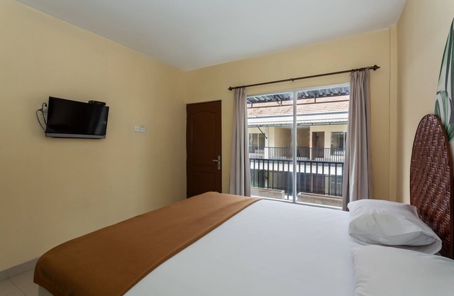 Cozy co-living that has two buildings separated by a pool to cool down and relax