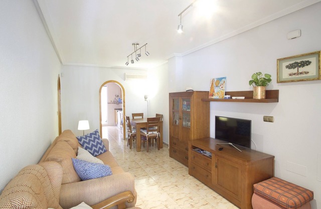 Cozy family apartment with patio and terrace and communal swimming pool