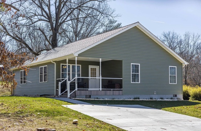 Cozy home with a modern kitchen, spacious living, serene bedrooms, and a private deck for relaxation