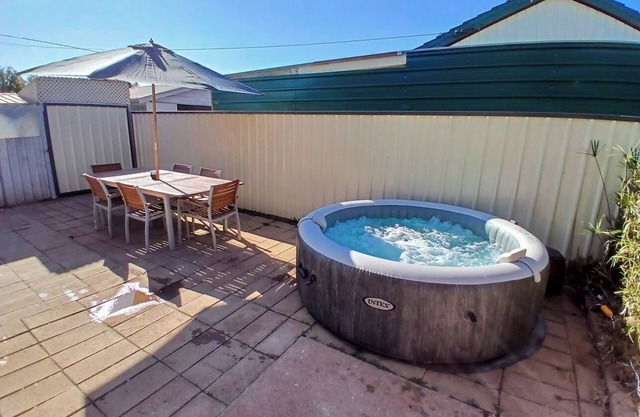 Cozy industrial home with hot tub & fruit garden