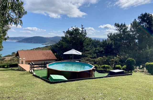 Cozy, private oceanfront cottage with pool just steps to the beach!