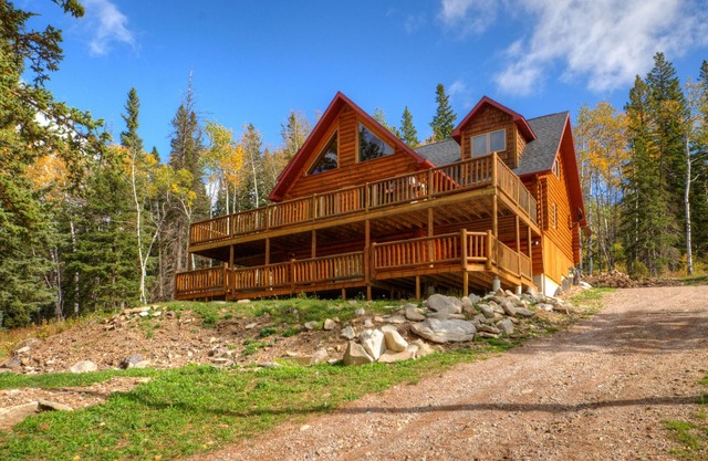 Custom log lodge with private hot tub, gorgeous decks, game room & fireplaces