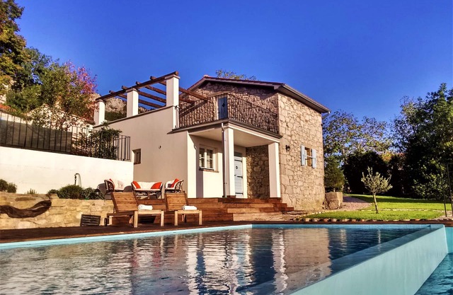 Cute vacation house surrounded by green area