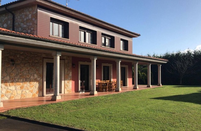 Detached house with large garden, perfect for families.