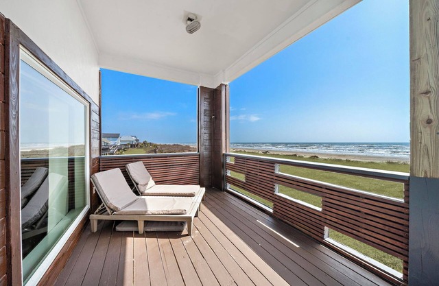 Direct beachfront 4 bedroom home with endless open concept ocean views