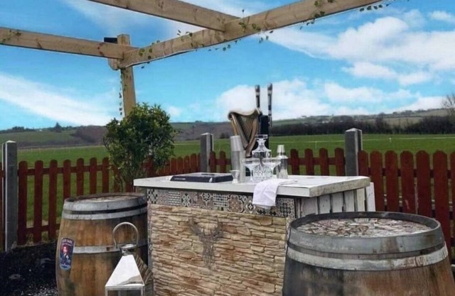 Double decker bus and hot tub/bar and patio