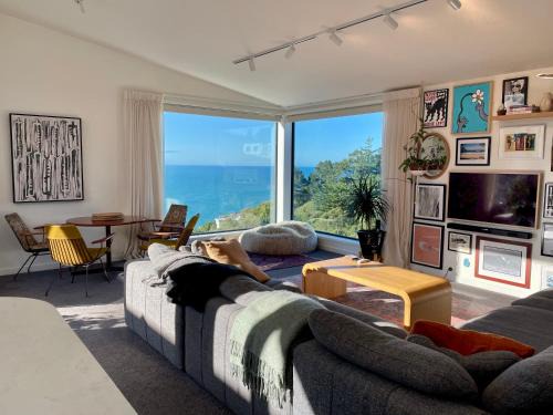 Elevated architectural home with stunning sea views