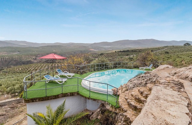 Enjoy a unique view of the countryside in this comfortable vacation home with pool.